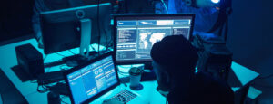 Man doing cyber research on laptop and computer