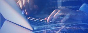 Man typing on keyboard